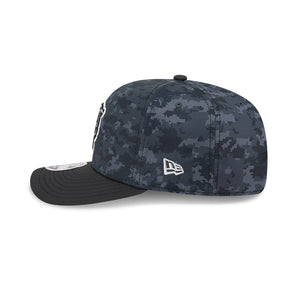 Black baseball cap with mesh back on a white background