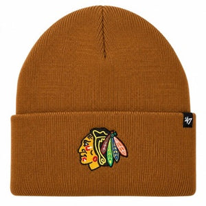 A ribbed knit beanie hat in a warm brownish-orange tone, featuring a folded cuff with the Chicago Blackhawks logo embroidered on the front and a small black '47 brand tag on the right side.