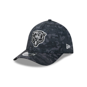 A dark gray and black digital camouflage baseball cap featuring a white embroidered Chicago Bears bear head logo on the front and a white New Era flag logo on the side.