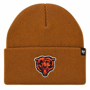 A ribbed knit beanie hat in a warm burnt orange-brown color, featuring an embroidered Chicago Bears logo on the front cuff and a small black '47 brand tag on the right side of the cuff.