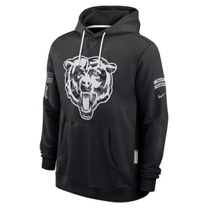 A black Nike pullover hoodie featuring a large white Chicago Bears bear head graphic on the front, with white drawstrings, a kangaroo pocket, and sleeve patches.