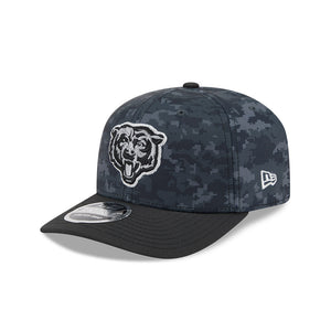 A Chicago Bears baseball cap featuring a dark blue and black digital camouflage pattern, a black brim, a white embroidered bear logo on the front, and a white New Era flag logo on the side.