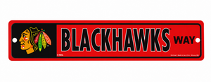 A rectangular metal sign featuring the Chicago Blackhawks logo on a black background on the left, with the words 'BLACKHAWKS WAY' in large black letters outlined in white on a red background on the right. The sign has rounded corners and two pre-drilled holes on the left side.