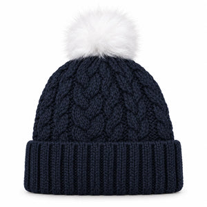 A navy blue cable-knit beanie hat with a white faux-fur pom-pom on top, shown against a plain white background.