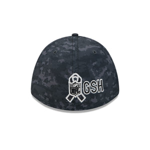 A dark digital camouflage baseball cap featuring a white embroidered NFL shield with a ribbon and the letters 'GSH' on the front, set against a plain white background.