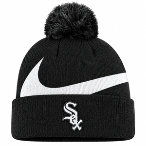 A black knit pom-pom beanie featuring a large white Nike swoosh across the front and a white Chicago White Sox logo on the folded cuff.