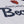 Close-up of a white Chicago Bears jersey or shirt fabric showing the navy team name, part of the orange bear head logo, and the word 'Bea' in navy script.